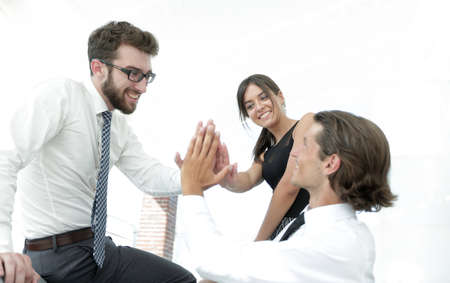 members of the business team give each other high five