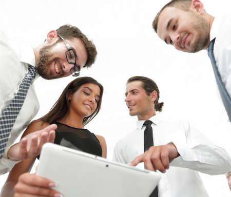 closeup of business team looking at digital tablet.の写真素材