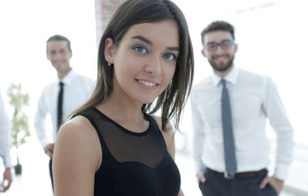 young employee of the company on the business background of the teamの写真素材