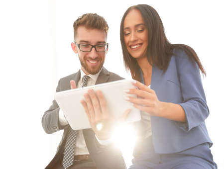 A confident manager discusses with a colleague a project pointinの写真素材