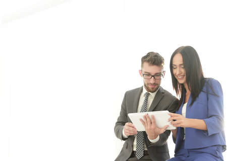 A confident manager discusses with a colleague a project pointinの写真素材