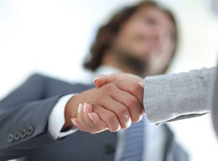 Businessmen handshaking after successful business meeting