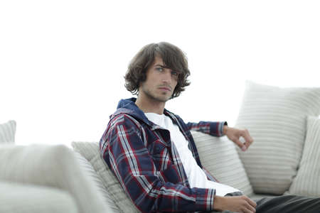 handsome successful guy sitting on the couch.の写真素材