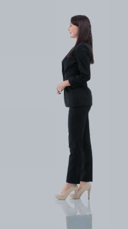 Business woman stand profile with white wall backgroundの写真素材