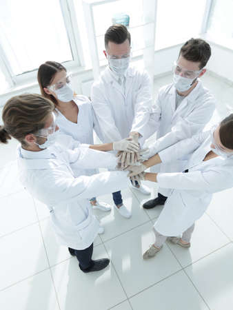 Health care workers demonstrating unity;