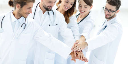 Joyful doctors are proud of their teamwork