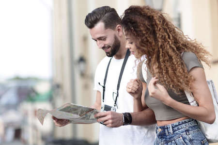 A pair of happy young tourists sightseeing in summerの写真素材