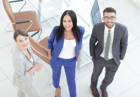 business partners discussing documents and ideas at meetingの写真素材