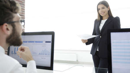 business colleagues working with financial documents