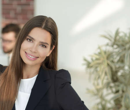 young business woman on the background of the office