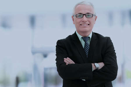 Portrait of an elegant  mature business man in the officeの写真素材