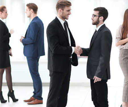 handshake of the employees in the lobby of the office.photo with copy spaceの写真素材