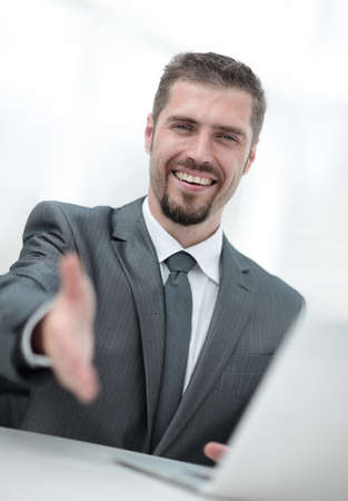closeup .a successful businessman extends his hand for a handshake,の写真素材