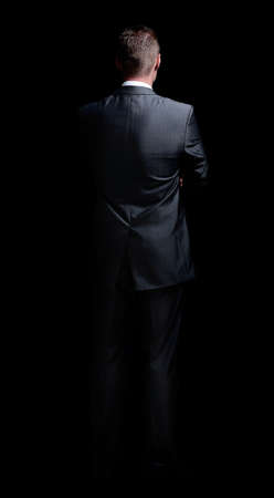 rear view .confident businessman looking at copy space.の写真素材