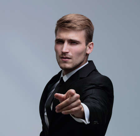 Portrait of a successful  business man showing his index fingerの写真素材