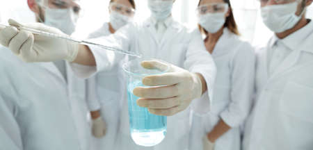 closeup of a group of medical workers working with liquidsの写真素材