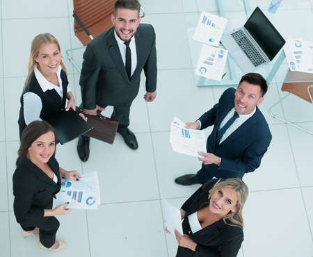 Image of business partners discussing documents and ideas at meeの写真素材