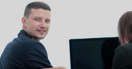 Face of a handsome businessman on the background of business people