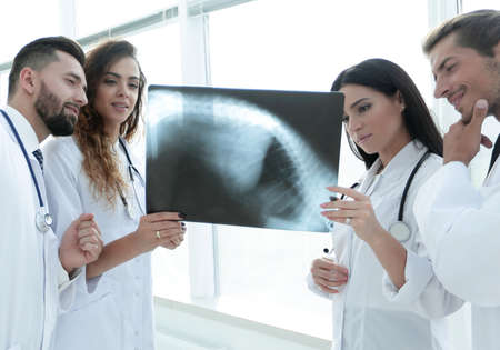group of doctors discussing an x-ray.の写真素材