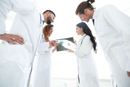group of doctors discussing an x-rayの写真素材