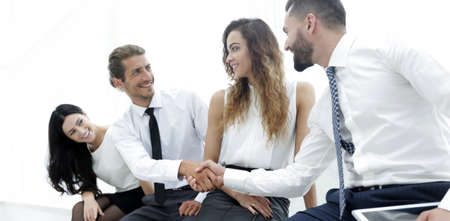 welcome handshake between two colleagues.