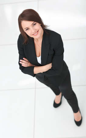 photo in full growth, successful business woman looking at camera.の写真素材