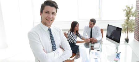 successful businessman on background of office.