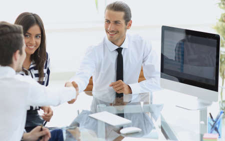 Business people shaking hands, finishing up a meeting