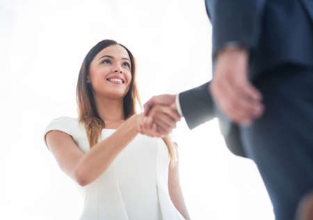 Business woman shaking hand to her partner