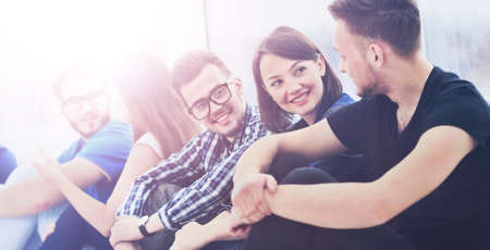 student group chatting indoorsの写真素材