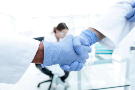 hand in the medical glove (handshake)の写真素材