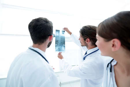 Portrait of happy surgeons holding x-ray reportの写真素材