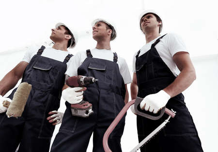 Group of professional industrial workers. Isolated over white background.の写真素材