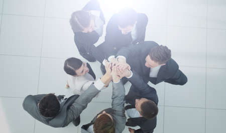 concept of the winning team .happy business team raising their aの写真素材
