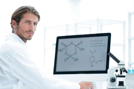 Medical doctor working with microscope in laboratoryの写真素材