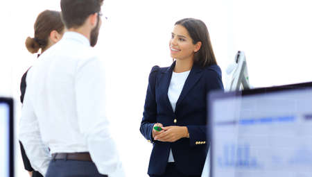 business team talking standing near desktop.の写真素材