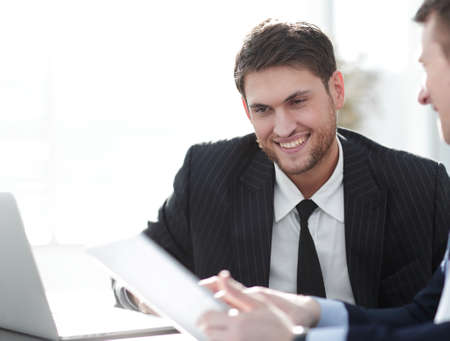 close-up.businessman talking to colleague.の写真素材