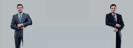 two business man showing blank signboard, isolated over white backgroundの写真素材