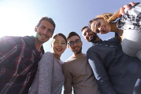 bottom view.a team of successful young people.の写真素材