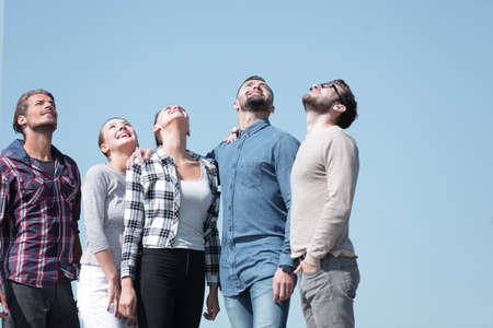 closeup.a team of young people looks upの写真素材