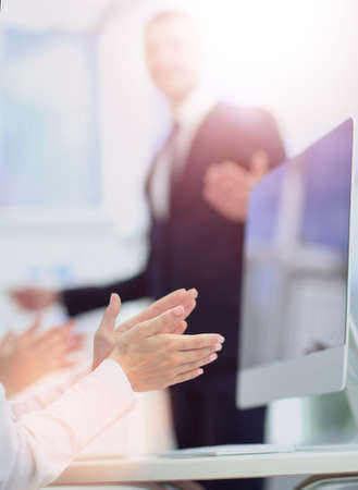 Business people clapping at conference