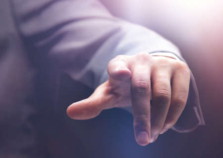 Hand pushing the imaginary  buttonの写真素材