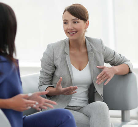 attractive female friends chatting during an office break
