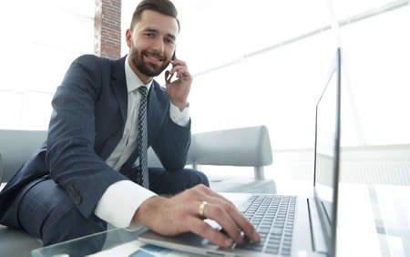 businessman solving business problems with a colleague through a modern phone
