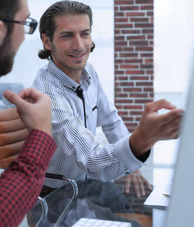 two employees discussing sales statisticsの写真素材