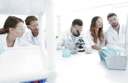 background image is a group of scientists working in the laboratory.の写真素材