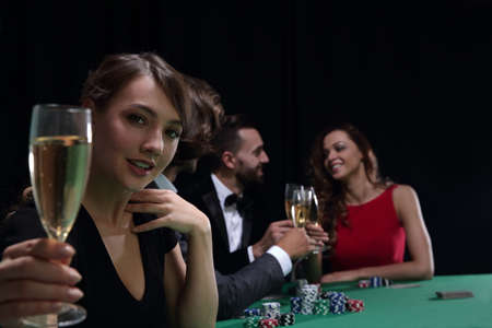 young beautiful woman playing in casinoの写真素材