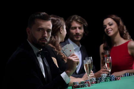 Handsome man playing in casino