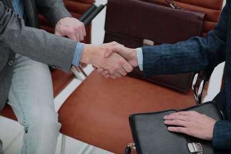 businessman shaking hands to seal a deal with his partnerの写真素材