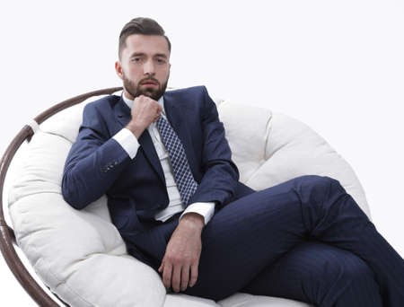 successful businessman sitting in a chair.の写真素材